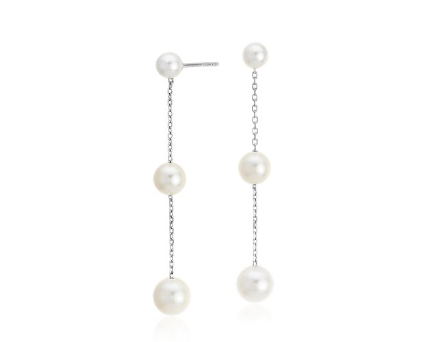 Three graduated pearls are joined by short strands of 14k white gold chain. The effect is a graceful dangle that is just the right length.