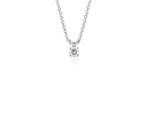Classically elegant, this cable chain diamond necklace features a striking round diamond pendant set in 14k white gold.