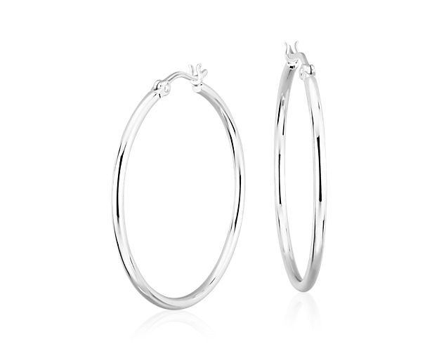 A style essential, these hoop earrings are crafted from sterling silver tubing for a polished, lightweight look, finished with a latch back closure.