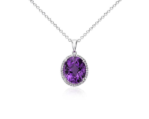 Brilliant and color-rich, this gemstone pendant features an oval amethyst framed by round white sapphires and set in sterling silver with a matching cable chain necklace.