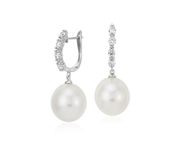 Make a dramatic statement with these striking South Sea cultured pearl earrings, showcasing round diamonds framed in 18k white gold.