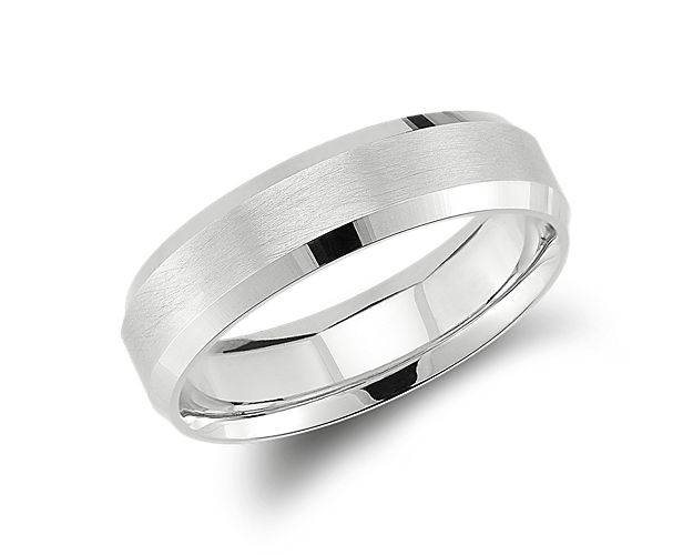 Solidify your love with this symbolic 14k white gold wedding ring, showcasing a classic matte finish and spun beveled edges.