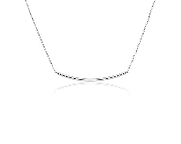 Understated and perfect for everyday style, this delicate curved bar necklace is crafted in sterling silver. The slim, polished bar is stationed along a classic cable chain that can be adjusted from 16 to 18 inches in length for versatility and is ideal for layering with other necklaces for an on-trend look.