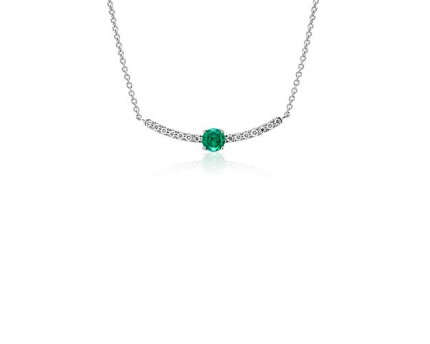 A lush, vibrant emerald adds a bold flourish to the dazzling diamonds in this 14k white gold smile necklace. An adjustable cable chain length delivers a just-right fit.
