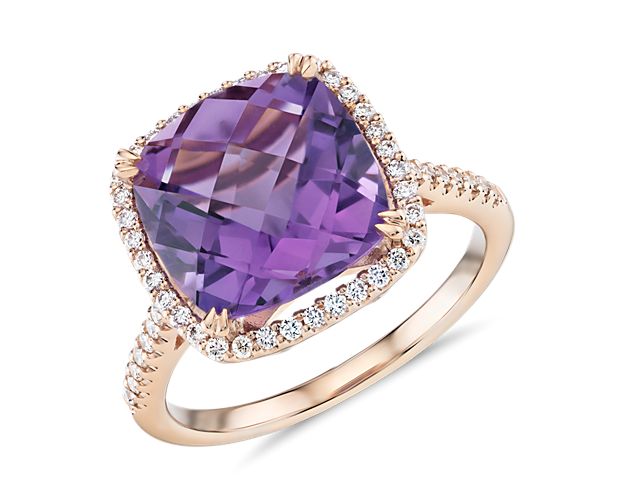 This gorgeous 14k rose gold cocktail ring features a cushion-cut amethyst surrounded by a halo of tiny pavé-set diamonds. An effortless upgrade to your accessory wardrobe.