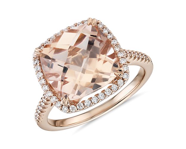 This gorgeous 14k rose gold cocktail ring features a cushion-cut morganite surrounded by a halo of tiny pavé-set diamonds. An effortless upgrade to your accessory wardrobe. To prevent damage to this delicate stone, we do not recommend this ring for daily wear.