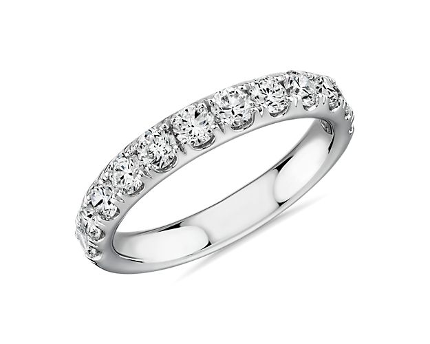 A pavé-set row of sparkling round brilliant diamonds shimmer brightly in this 14k white gold ring she'll treasure as a wedding or anniversary band.