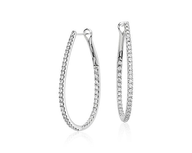 A classic with a twist, these alluring 14k white gold earrings showcase an interchanging outer and inner layer of diamonds, giving each hoop an all-around sparkle.