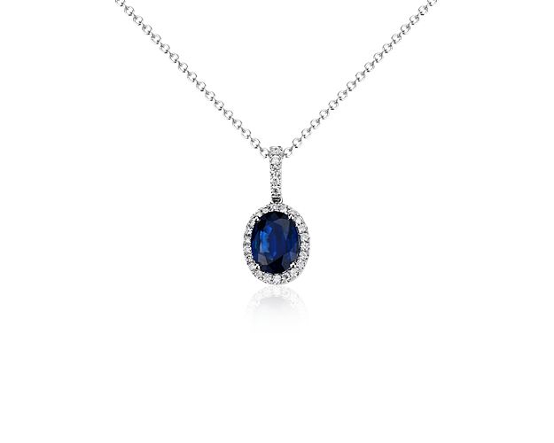 You'll light up the room with this striking blue sapphire oval pendant surrounded by micropavé diamonds in 14k white gold.