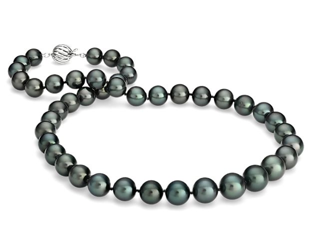Redefine a timeless style with the opulence of this strand of black Tahitian cultured pearls, showcasing multi-hued overtones and high luster.  The hand-knotted strand is finished with a 18k white gold, fluted-ball safety clasp. Blue Nile gemologists ensure that our pearls meet the highest quality expectations, ensuring you the best value.