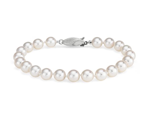 Our lustrous Akoya cultured pearl bracelet is strung with a 8" hand-knotted silk blend cord, secured with an 18k white gold safety clasp.