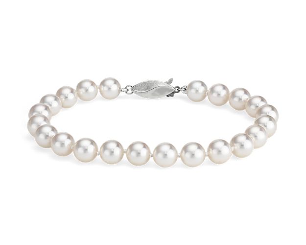 Our lustrous Akoya cultured pearl bracelet is strung with a 6.5" hand-knotted silk blend cord, secured with an 18k white gold safety clasp.