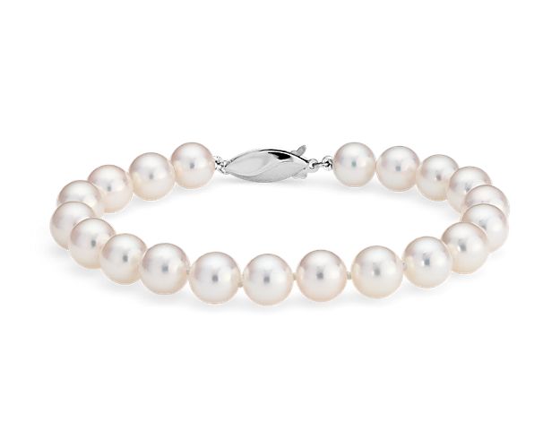 Our lustrous Akoya cultured pearl bracelet is strung with a 8" hand-knotted silk blend cord and secured with an 18k white gold safety clasp.