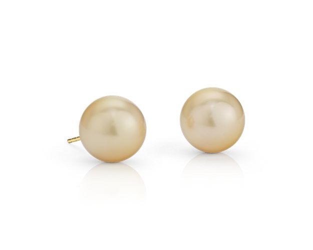 Beautiful and classic, these pearl stud earrings showcase South Sea cultured pearls with a subtle gold color and incredible luster set in 18k yellow gold.