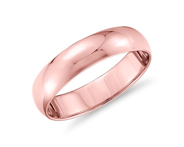 This classic 14k rose gold wedding ring will be a lifelong essential. The light overall weight of this style, its classic 5mm width, and low profile aesthetic make it perfect for everyday wear. The high polished finish and goes-with-anything styling are a timeless design.