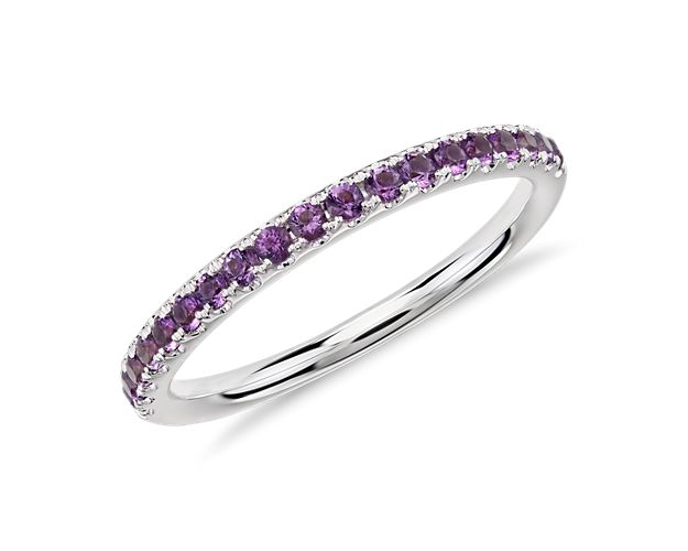 A dainty row of brilliant round amethysts in vivid purple are pavé set in this Riviera ring crafted of 14k white gold. A sweet sentiment on its own, or a shimmering statement when stacked with other gemstone and diamond bands from the Riviera collection.
