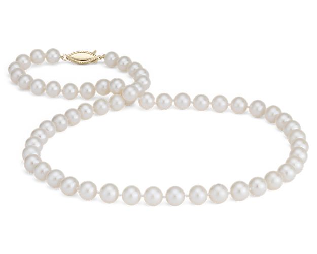 Our classic pearl strand features nearly round freshwater cultured pearls strung on a 16" hand-knotted silk blend cord.  This strand is finished with a secure safety clasp in 14k yellow gold.