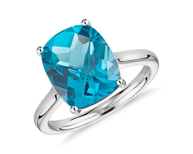 Make a splash with cool blue topaz in this bold statement ring crafted of 14k white gold.