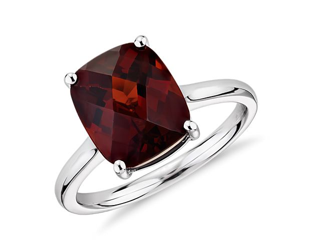 Rich red garnet makes a bold statement in this fashion-forward cocktail ring crafted of 14k white gold.