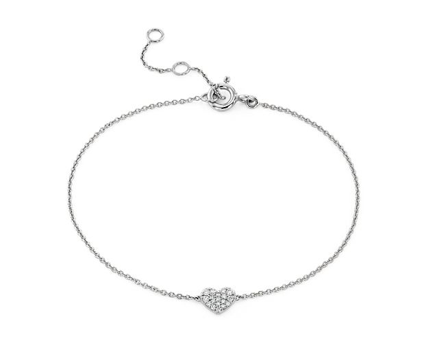 A petite heart, pavé-set with tiny diamonds is the focal point of this sweet bracelet crafted in gleaming 14k white gold.