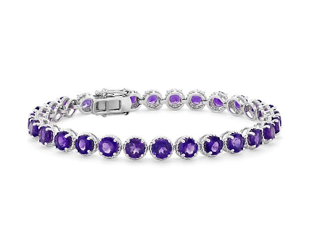 Brightly hued, this amethyst bracelet is crafted in sterling silver and features twenty-eight round amethyst gemstones in a flexible single line design.