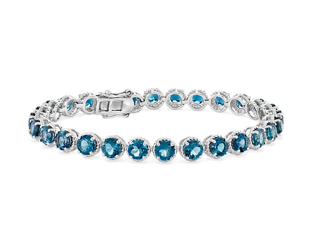 Delicately hued, this London blue topaz bracelet is crafted in sterling silver and features twenty-eight round london blue topaz gemstones in a flexible single line design.