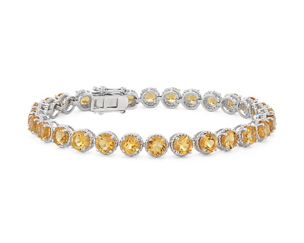 Brightly hued, this citrine bracelet is crafted in sterling silver and features twenty-eight round citrine gemstones in a flexible single line design.