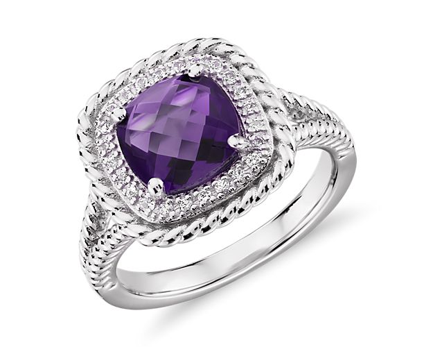 A gorgeous multi-faceted, cushion-cut amethyst is surrounded by a halo of white topaz and accented with a rope motif that extends partway down the shank. This sterling silver cocktail ring is just right for a bit of color to liven up any outfit.