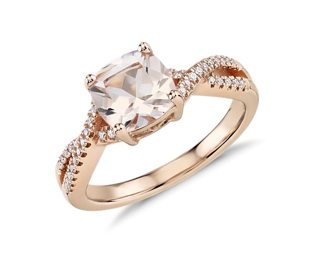 A vision of color, this gemstone ring features a cushion-cut morganite accented by brilliant pavé diamonds in an infinity twist design of warm 14k rose gold. To prevent damage to this delicate stone, we do not recommend this ring for daily wear.