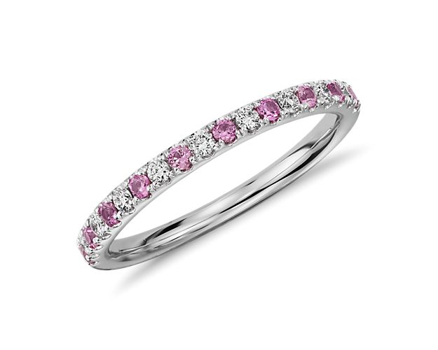 Brilliant sparkle and soft color, this sapphire and diamond wedding ring is crafted in a petite design of 14k white gold featuring pavé-set diamonds and pink sapphires.