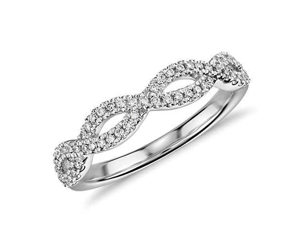 This beautiful and delicate wedding ring is designed with two rows of micropavé set diamonds intricately intertwined for an elegant statement.