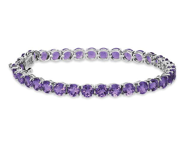 Brightly hued, this amethyst bracelet is crafted in sterling silver and features thirty-four round amethyst gemstones in a flexible single line design.