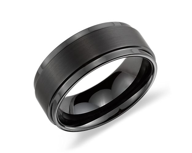 Contemporary in style, this men's wedding ring is crafted in durable black tungsten carbide. The design features a brushed finish and polished edges for contrast.