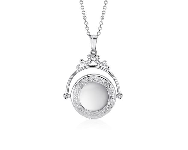 An heirloom perfect piece, this spinning locket is crafted in sterling silver with a Victorian-inspired design on a cable chain necklace. The locket pendant holds two pictures. Engrave for a personalized touch.