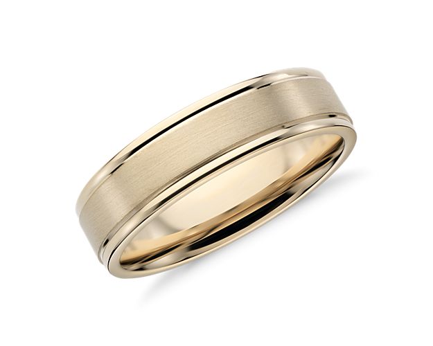 You'll love the subtle detail of this brushed inlay wedding ring. Crafted in brightly polished 14k yellow gold with a brushed finish center band, this timeless ring features curved inner edges for endlessly comfortable wear.