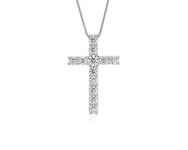 Beautifully crafted, this impressive diamond cross pendant showcases 2 carats of brilliant Blue Nile Signature Ideal Cut round diamonds set in a classic platinum design with a versatile adjustable length matching chain.  This pendant is accompanied by a GCAL report.