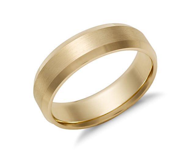 Solidify your love with this symbolic 14k yellow gold wedding ring, showcasing a classic lathe emery finish and spun beveled edges.