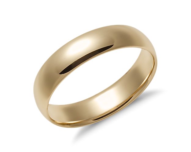 This 14k yellow gold wedding ring is the ideal mid-weight style with a traditional higher domed outside profile. Curved inner edges make this style extra comfortable for everyday wear. This comfort-fit yellow gold ring features a high polished finish.