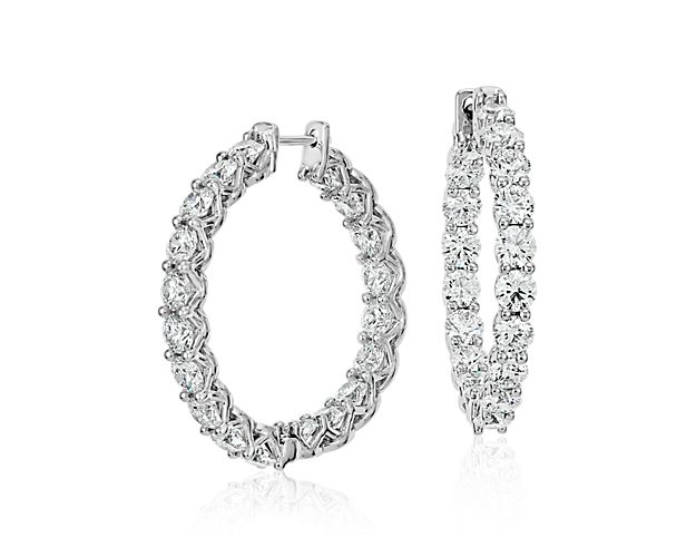 Dramatic elegance, these diamond hoop earrings showcase 6 carats of brilliant Blue Nile Signature Ideal cut round diamonds set in enduring Platinum, an extraordinary gift appropriate for every occasion. Earrings accompanied by a GCAL report.