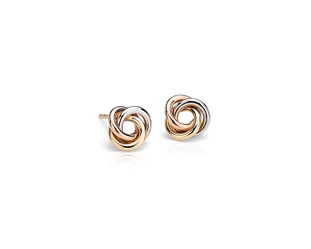 Classic and colorful, these petite tri-color stud earrings are sculpted from hollow 14k white, rose and yellow delicate gold links into a polished mini love knot design with a push backing closure.