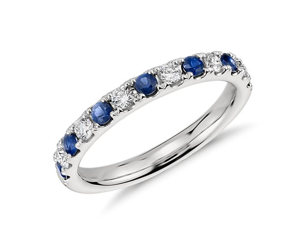 Classic and stunning, this sapphire and diamond band features alternating stones set in enduring platinum,  perfect for a wedding or anniversary band.