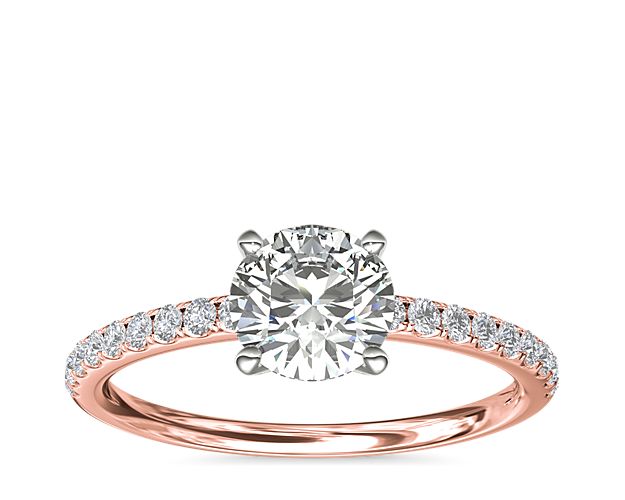 Classic elegance, this diamond engagement ring setting features pavé-set diamonds set in 14k rose gold.