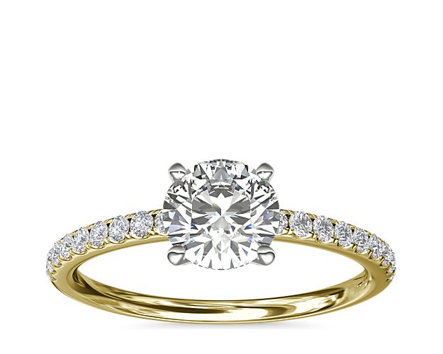Classic elegance, this diamond engagement ring setting features pavé-set diamonds set in 18k yellow gold.