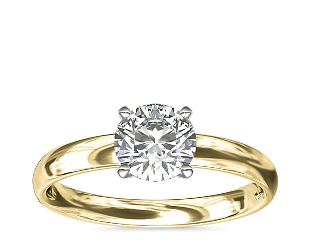 Thanks to its striking simplicity, solitaire engagement rings are perhaps our most popular style. This one, crafted in 18k yellow gold, features a rounded inside edge for comfort. A six-prong ring head, which provides extra security, is available upon request for select diamond shapes.