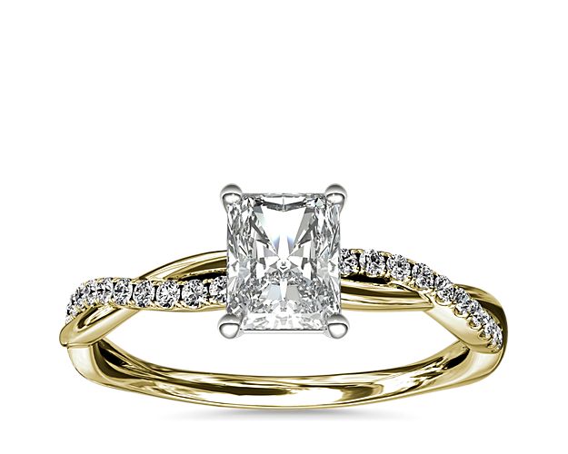 Classic with a twist, this 14k yellow gold engagement ring features a delicate twist of pavé-set diamonds that will complement the center diamond of your choice.