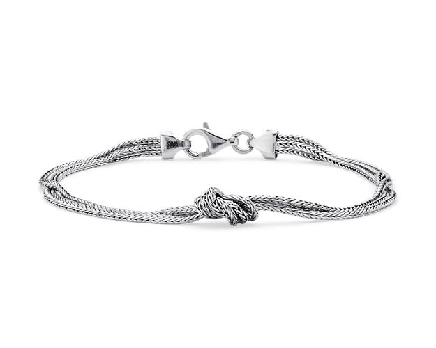 Finish off your ensemble with this sophisticated sterling silver bracelet, featuring three wheat chain strands and a knotted design.