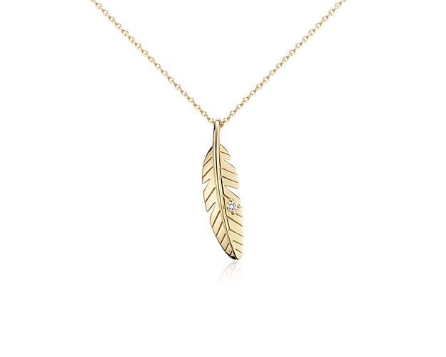 Give your jewelry collection a lift with this dainty 14k yellow gold feather pendant, featuring a delicate round diamond accent and matching cable chain necklace with two-inch extender for easy adjustment to 16-inches or 18-inches.