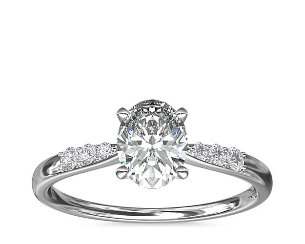 Complement your center diamond perfectly with this 14k white gold engagement ring accented with pavé-set diamonds along the shank.