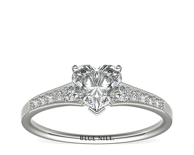 Ideal for any center diamond of your choice, this 14k white gold engagement ring showcases a diamond accent along the shank and milgrain detailing.