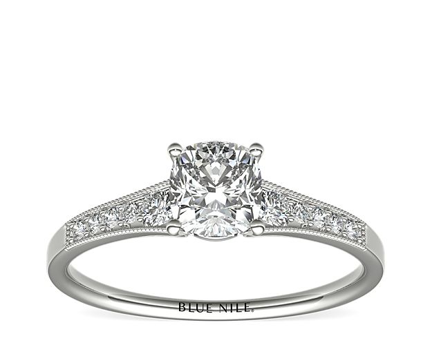 Ideal for any center diamond of your choice, this platinum engagement ring showcases a diamond accent along the shank and milgrain detailing.
